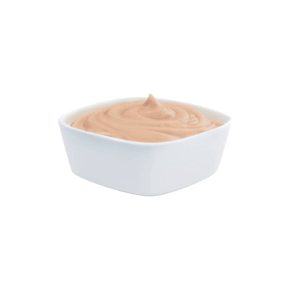 White bowl filled with a beige cream on a white background